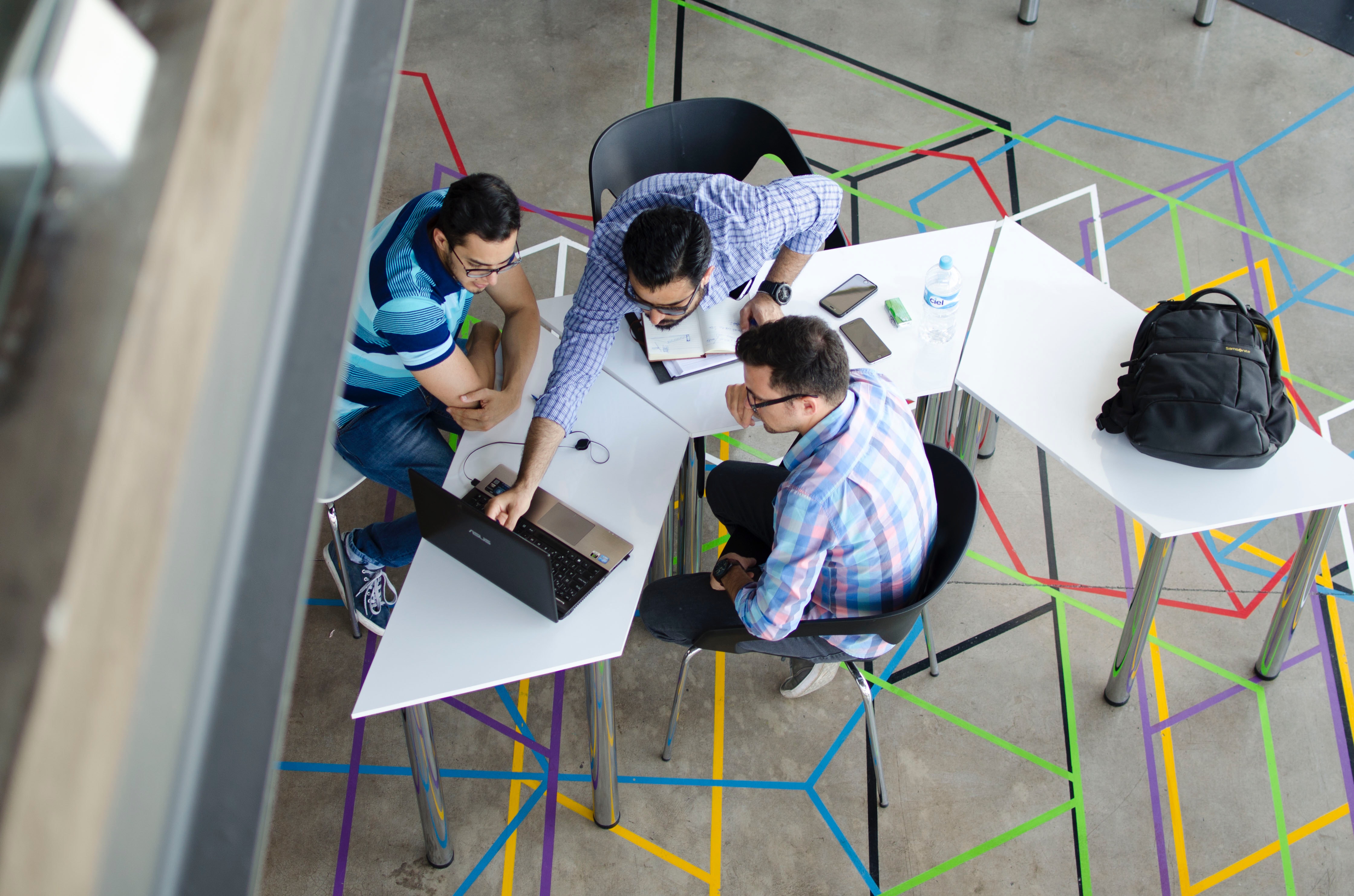 image of creative people doing work at a table