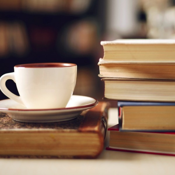 Stack of books and coffee cup