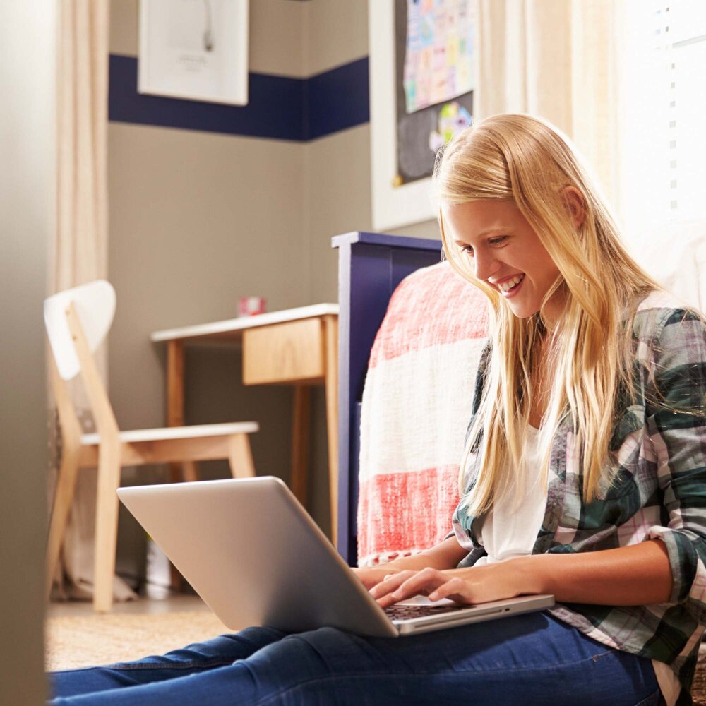 Girl sitting with laptop