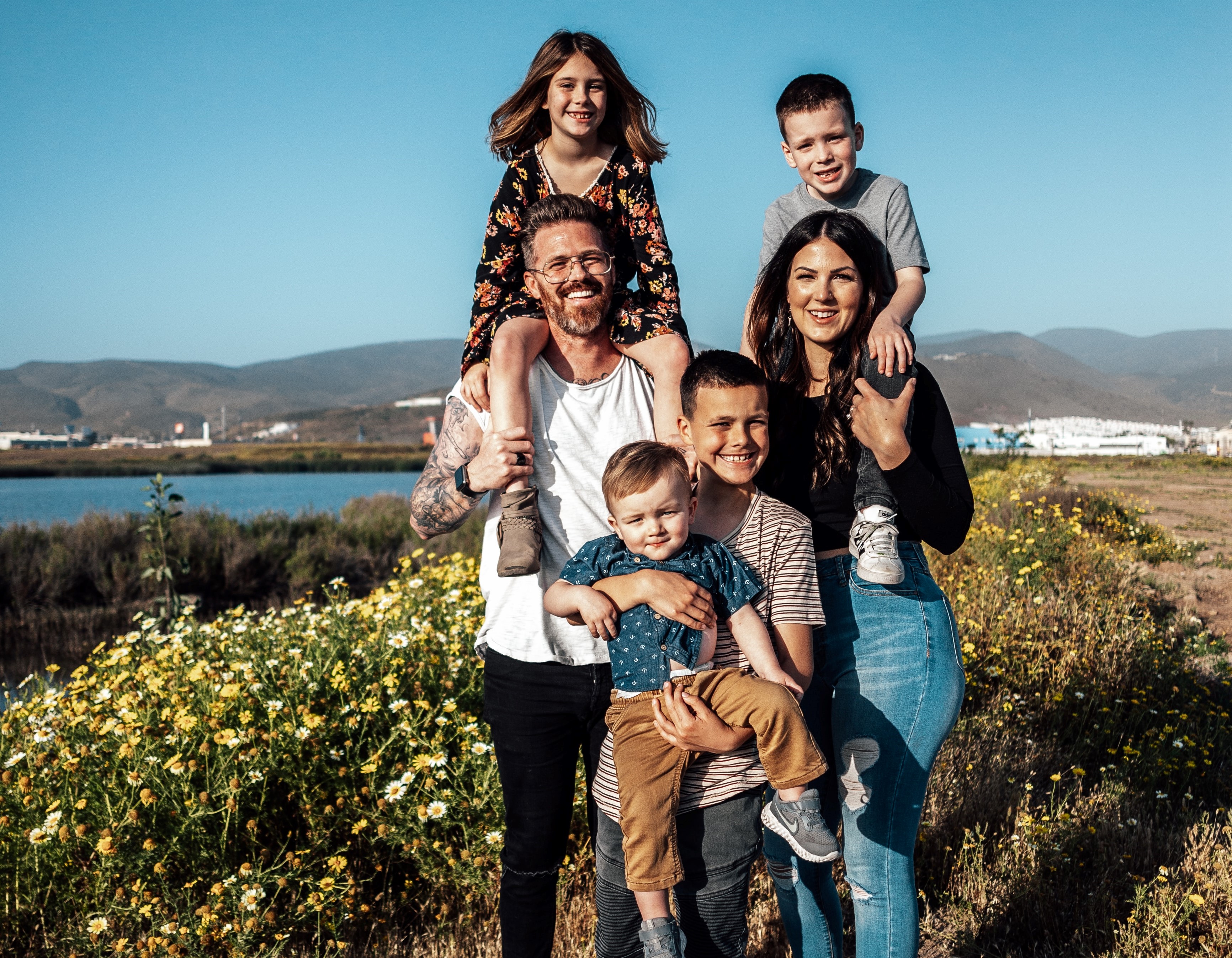 family of 6 standing in a field